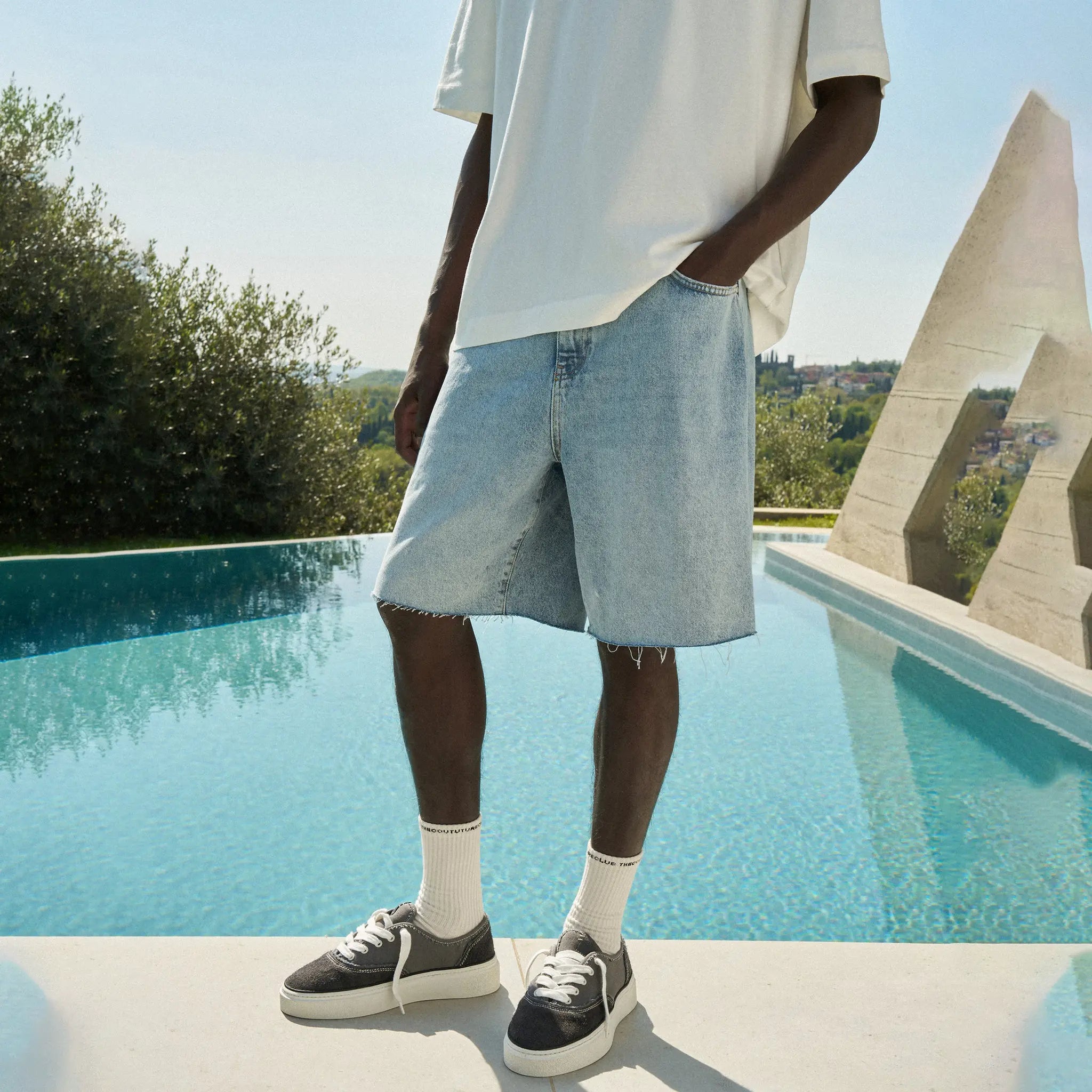 Front View of The Couture Club Raw Edge Mid Stone Wash Denim Shorts